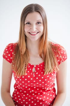 Studio portrait of happy smiling attractive woman wearing red blouse