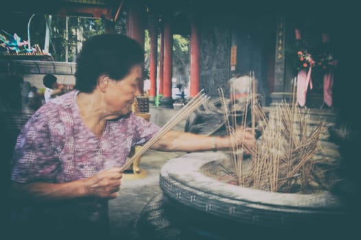 New Taipei City, Taiwan - October 23, 2011: traditional asian praying for chinese god at New Taipei City on October 23,2011 in Taipei,Taiwan (Editorial Use Only)