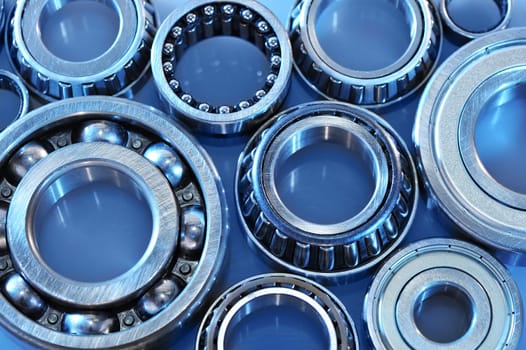 Close-up of various ball bearings in blue light