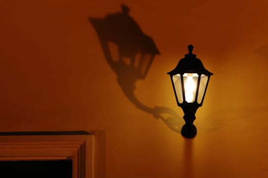 A vintage decorative lantern with shadow