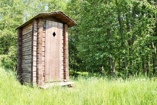 Old wooden outhouse for tourists at a forest