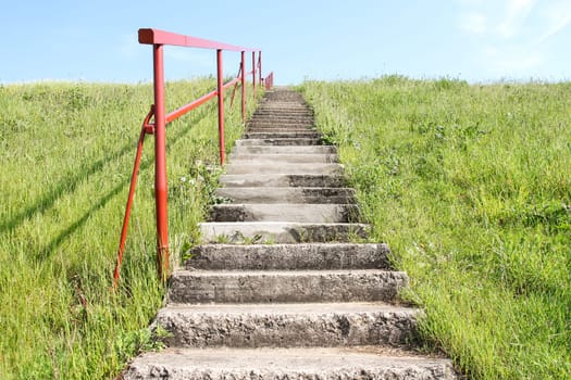 Staircase direct the way forward on a small hill