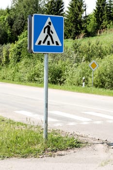 Road  sign with zebra pattern pedestrian crossing