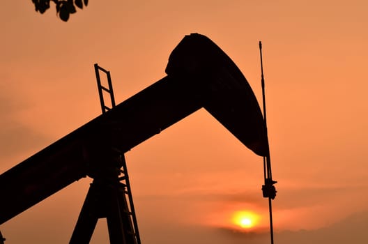 pumpjack pumping crude oil from oil well