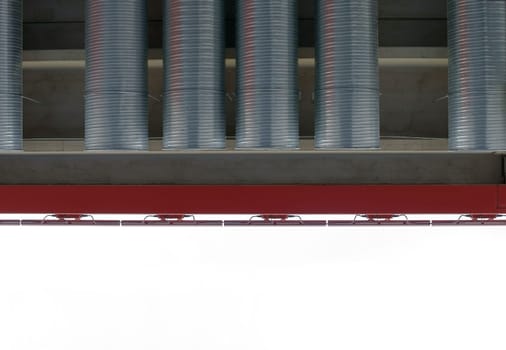 The photograph of vent pipes from a roof edge.