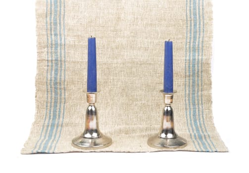Candlestick on linen cloth