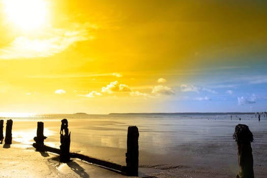 sunshine over the beach breakers in Youghal county Cork Ireland on a summers day