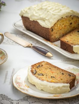 Beautiful and delicious homemade carrot cake on antique tableware