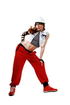 A lovely woman in red pants, jeans jacket and a hat standing bend.forwards isolated on white background..