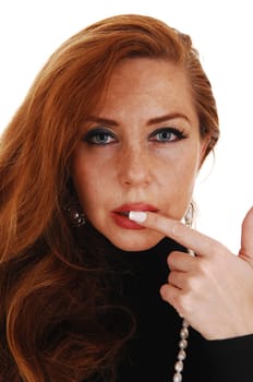 A closeup portrait picture of a classy woman in a black dress, holding.her finger on the mouth, isolated for white background..