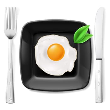 Served breakfast. Fried egg on black plate served with fork and knife