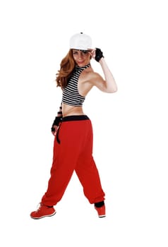 A lovely woman in red pants, jeans jacket and a hat standing from the.back, isolated on white background..