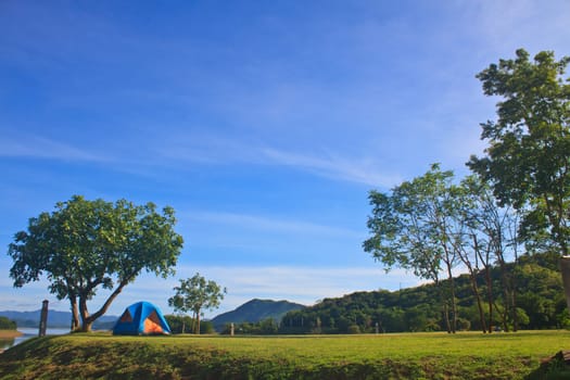 Camping in the wilderness, tent on campground in morning