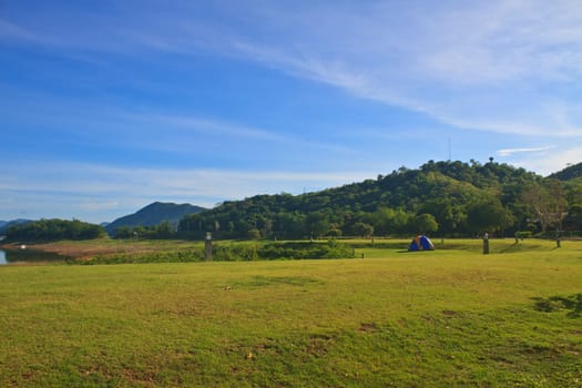 Camping in the wilderness, tent on campground in morning
