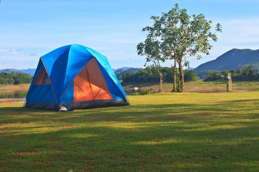 Camping in the wilderness, tent on campground in morning