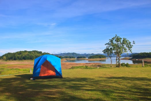 Camping in the wilderness, tent on campground in morning