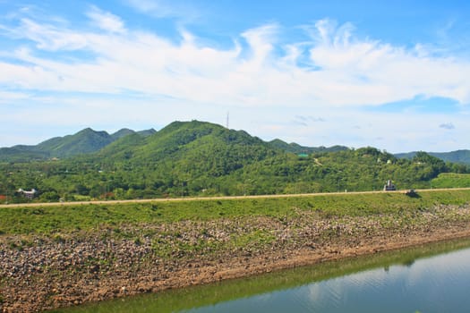 Kaeng Krachan Dam, Thailand, asphalt road and blue sky on top of DAM