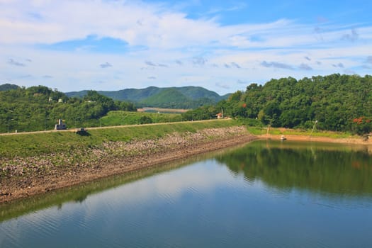 Kaeng Krachan Dam, Thailand, asphalt road and blue sky on top of DAM