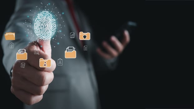 Businessman using fingerprint scanner to log in showing cyber security protection and data security concept including secure login