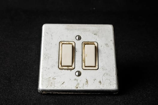 Light switch, old-style on a Black Background