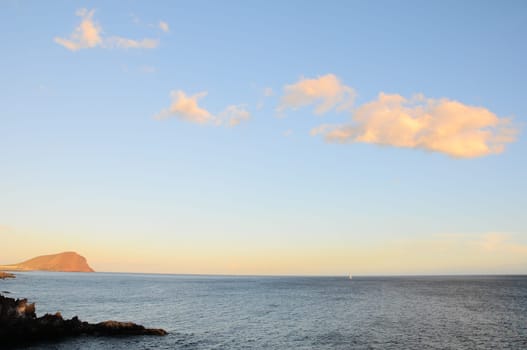 Cloudscape, Colored Clouds at Sunset near the Ocean