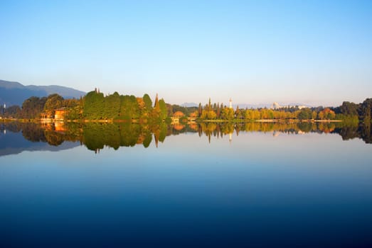 The reflection of forest, pagoda and hut
