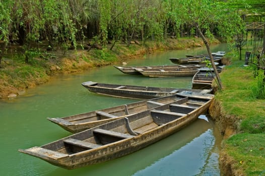 The anchored boats on a river of city park