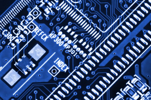 Details of electronic circuit board in blue tone