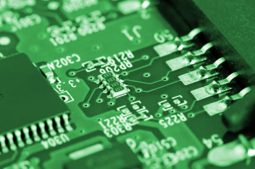 Details of electronic circuit board in green tone