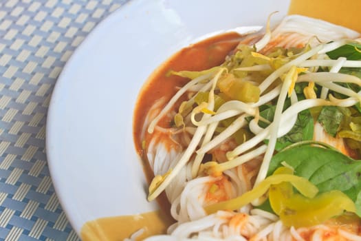 Thai vermicelli eaten with curry and vegetable close up