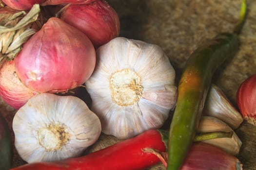 thai kitchen food spice herb pepper red onion garlic for cooking on top wood table