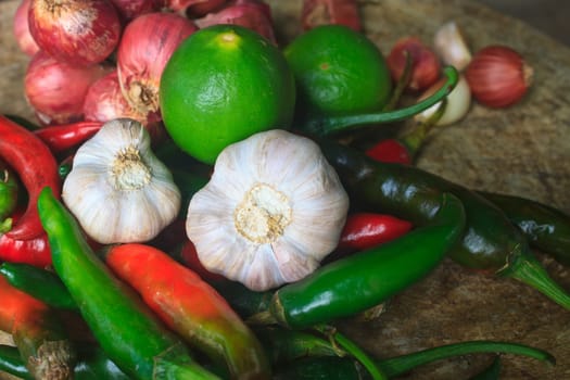 thai kitchen food spice herb pepper red onion garlic for cooking on top wood table