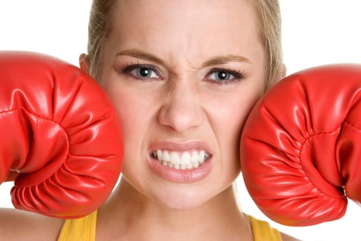 Young woman wearing boxing gloves