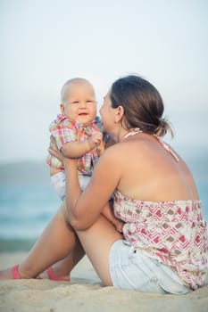 Baby and mother outdoor portrait