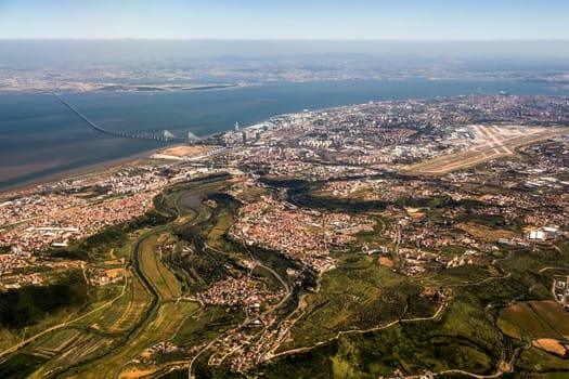 View over Lisbon, Portugal with airport, ponte vasco da gama, river tejo
