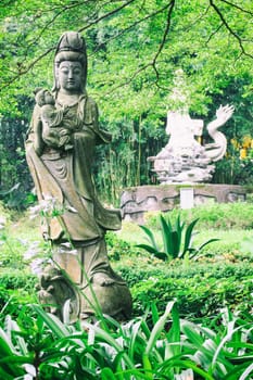 Sculptures of Chinese gods. (Kuan Yin) in the park.