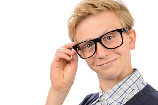 Confident teenage nerd boy holding geek glasses against white background