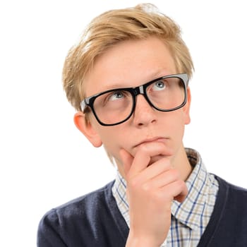 Thoughtful teenage nerd boy wearing geek glasses against white background