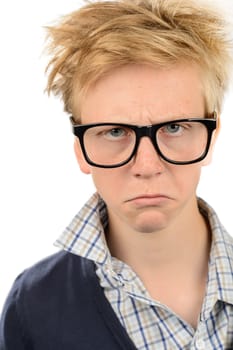 Angry teenage nerd boy wearing geek glasses against white background