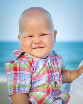 Cute baby on the tropical beach
