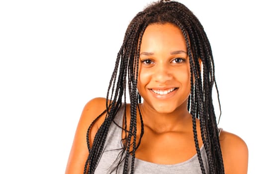 Portrait of a young african girl with black dreadlocks smiling at camera ans showing her teeth, isolated over a white background.