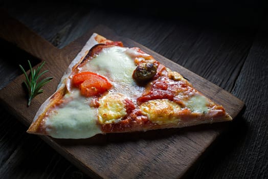 Slice of home made pizza close up shoot