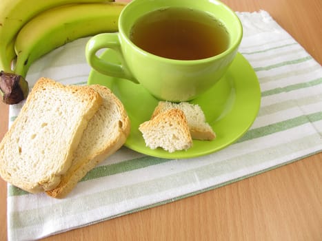 Tea with biscuits and banana