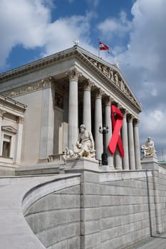 Solidarity with HIV,red ribbon to commemorate the Austrian Parliament