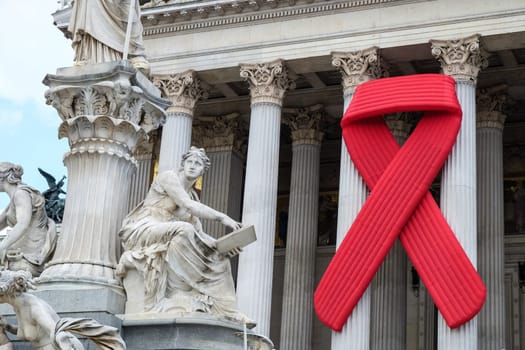 Solidarity with HIV,red ribbon to commemorate the Austrian Parliament