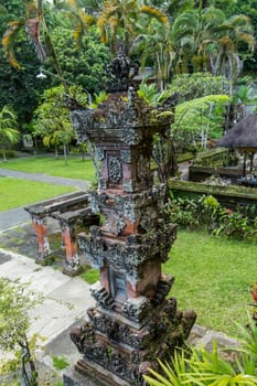 Artful carvings in stone stonemasonry in a green complex in Bali