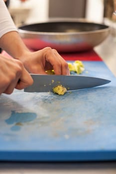 chef cuts fresh green vegetables in the restaurant kitchen food food cooking
