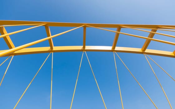 detail of the yellow arch bridge in Utrecht, netherlands. The Hogeweide Bridge is a steel arch bridge over the Amsterdam-Rhine Canal