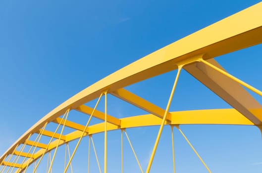 detail of the yellow arch bridge in Utrecht, netherlands. The Hogeweide Bridge is a steel arch bridge over the Amsterdam-Rhine Canal