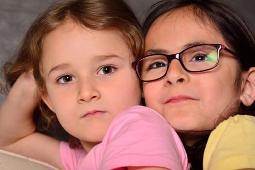 Two little cute sisters posing